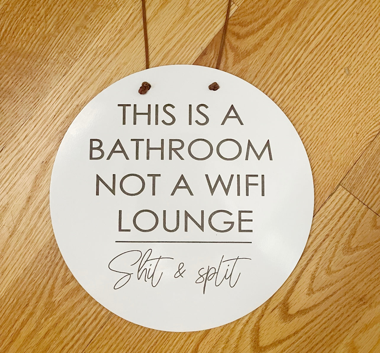 This is a bathroom not a wifi lounge, shit & split sign